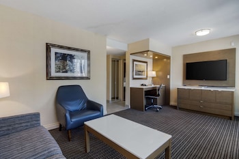 Hypo-allergenic bedding, in-room safe, desk, laptop workspace at Best Western Premier Chateau Granville Hotel & Suites & Conf. Centre