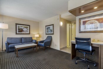 Hypo-allergenic bedding, in-room safe, desk, laptop workspace at Best Western Premier Chateau Granville Hotel & Suites & Conf. Centre