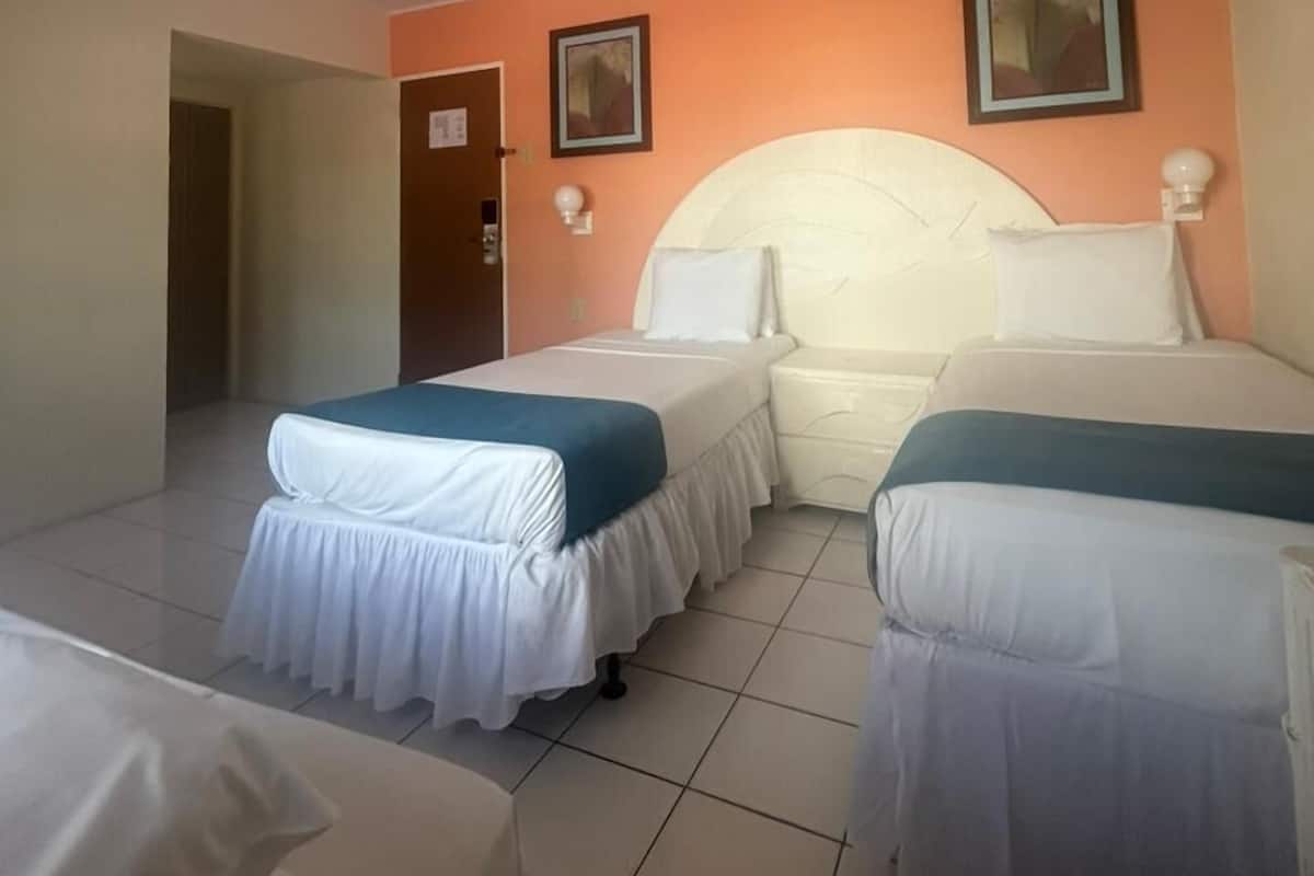 Triple Room, City View | In-room safe, desk, laptop workspace, soundproofing
