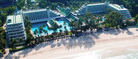 On the beach, white sand, sun-loungers, beach umbrellas