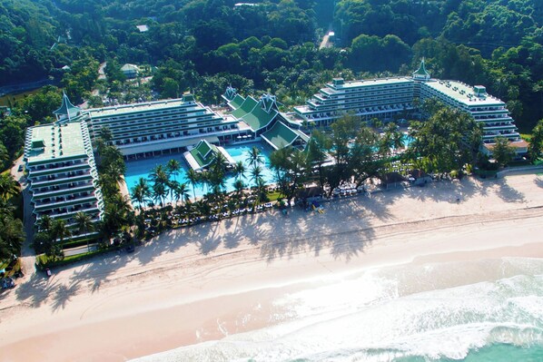 On the beach, white sand, sun loungers, beach umbrellas