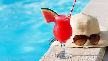 Outdoor pool, pool umbrellas, sun loungers