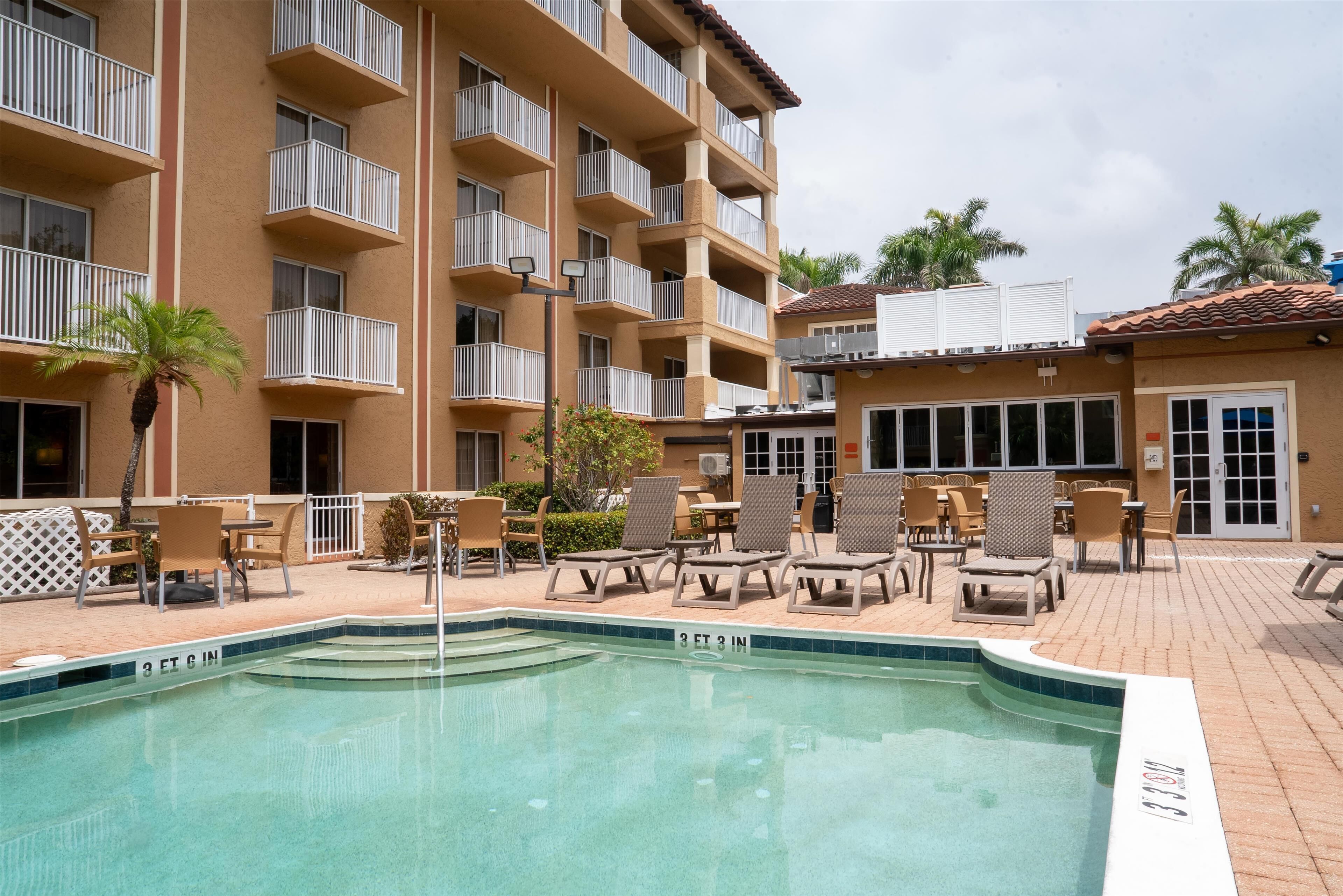 outdoor pool, pool umbrellas, pool loungers