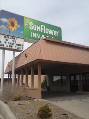 A SunFlower Inn & Suites sign with a sunflower graphic, indicating a new establishment.