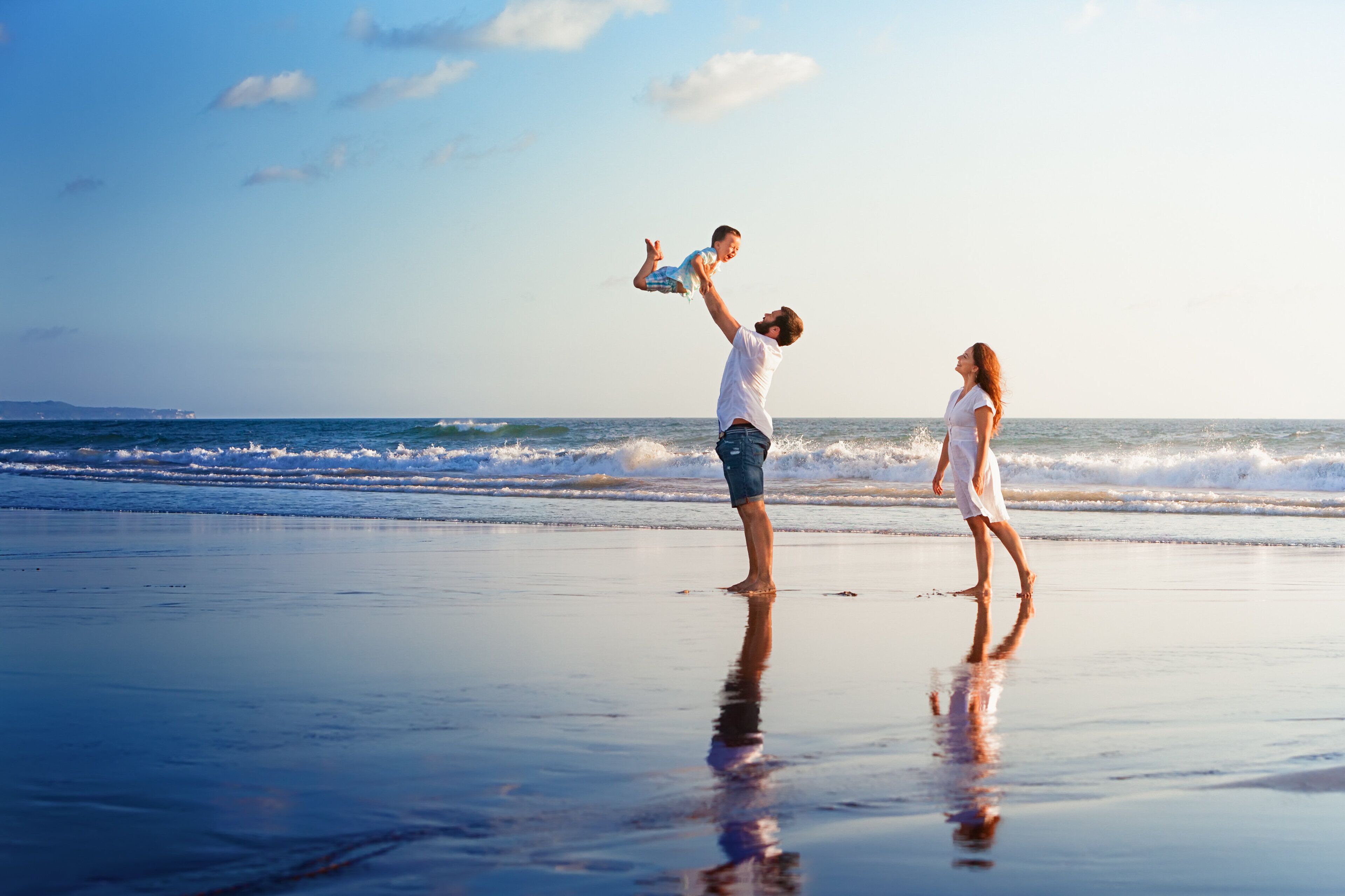 A beach scene with a family.