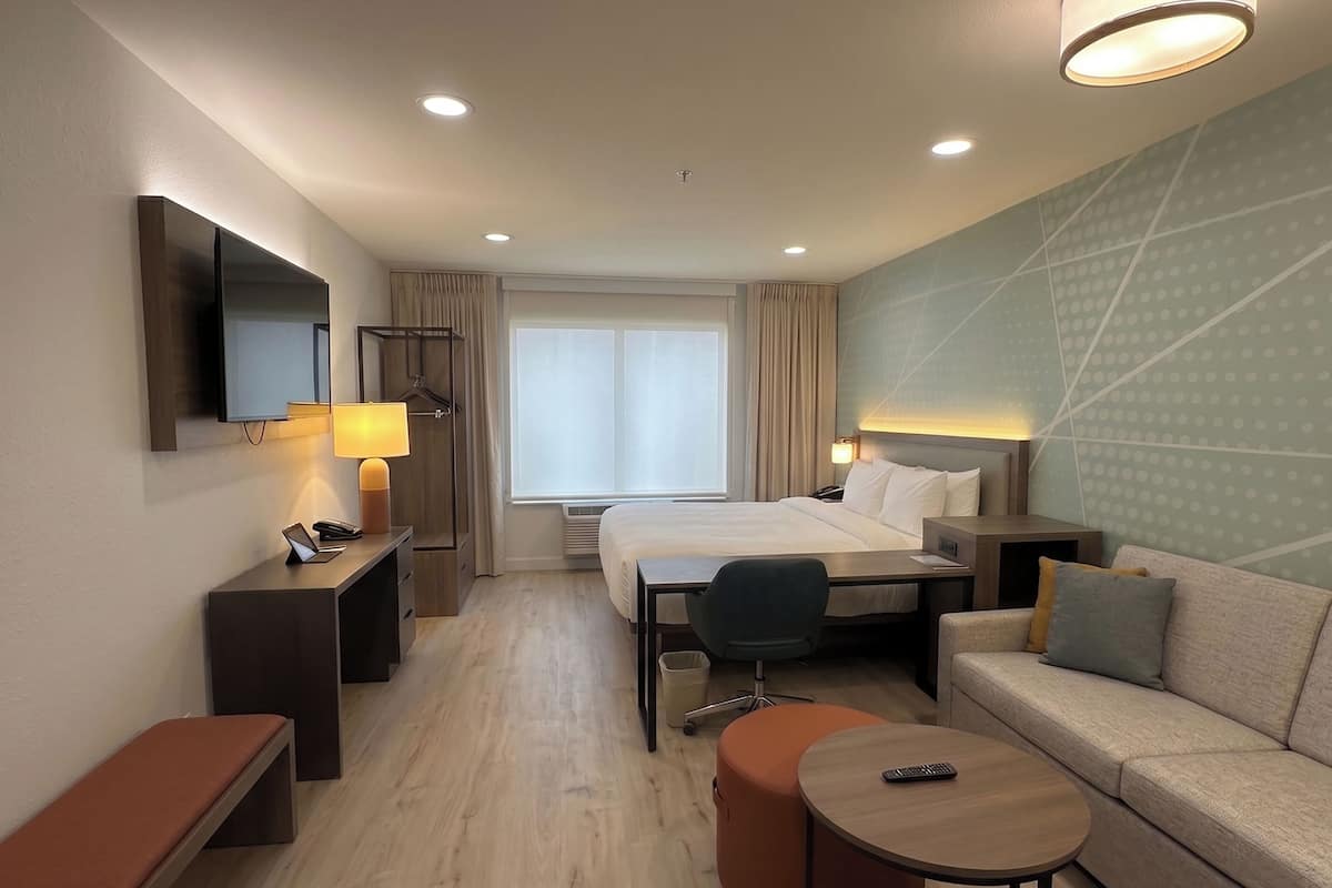 Suite, 1 King Bed with Sofa bed, Non Smoking | Desk, laptop workspace, iron/ironing board, free WiFi