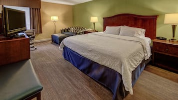Premium bedding, desk, laptop workspace, blackout drapes