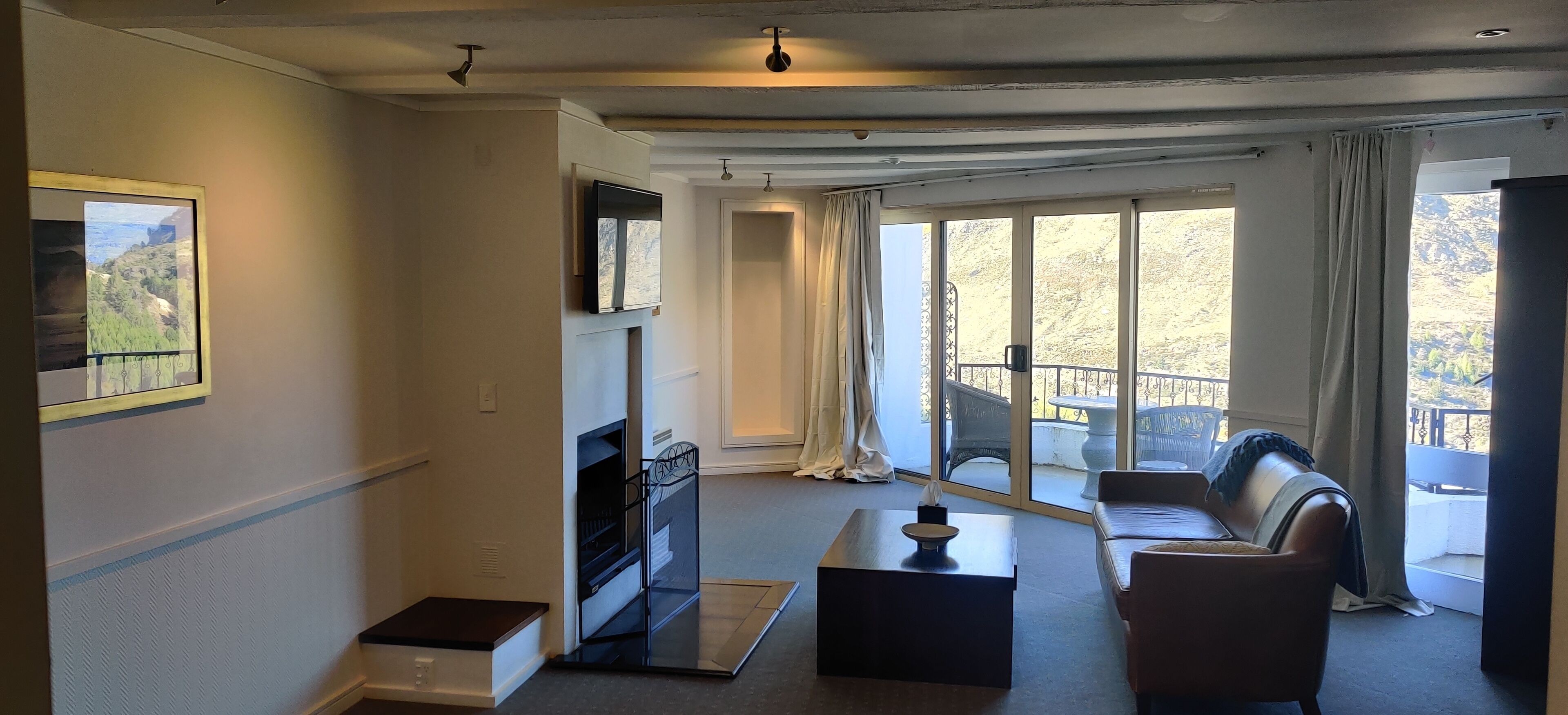 executive river view suite | living area | tv