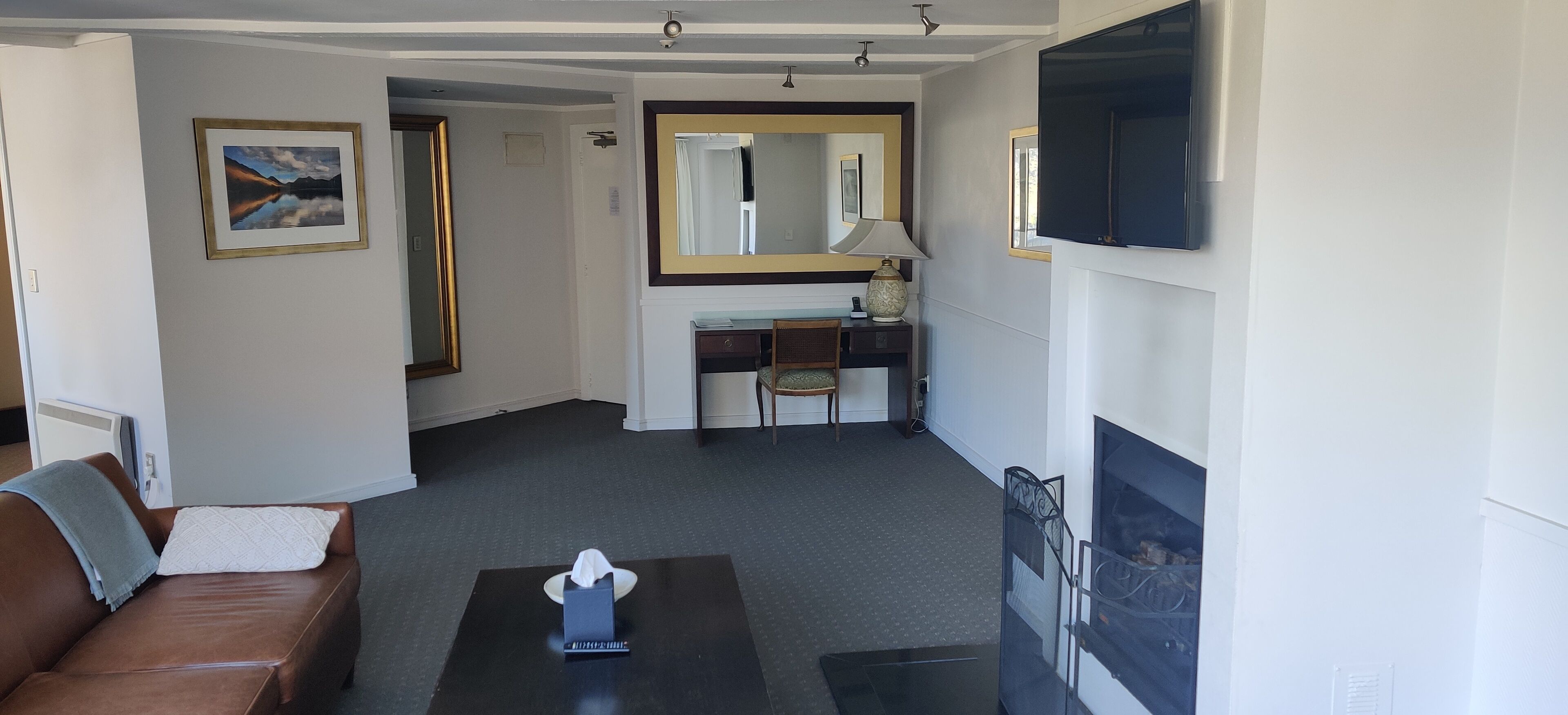 executive river view suite | living area | tv