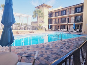 Seasonal outdoor pool, open 10:00 AM to 9:30 PM, pool loungers