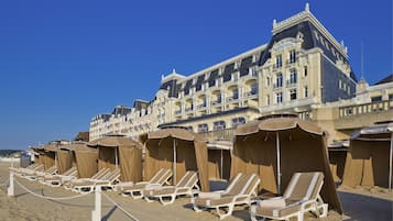 On the beach, sun-loungers, beach umbrellas, beach towels