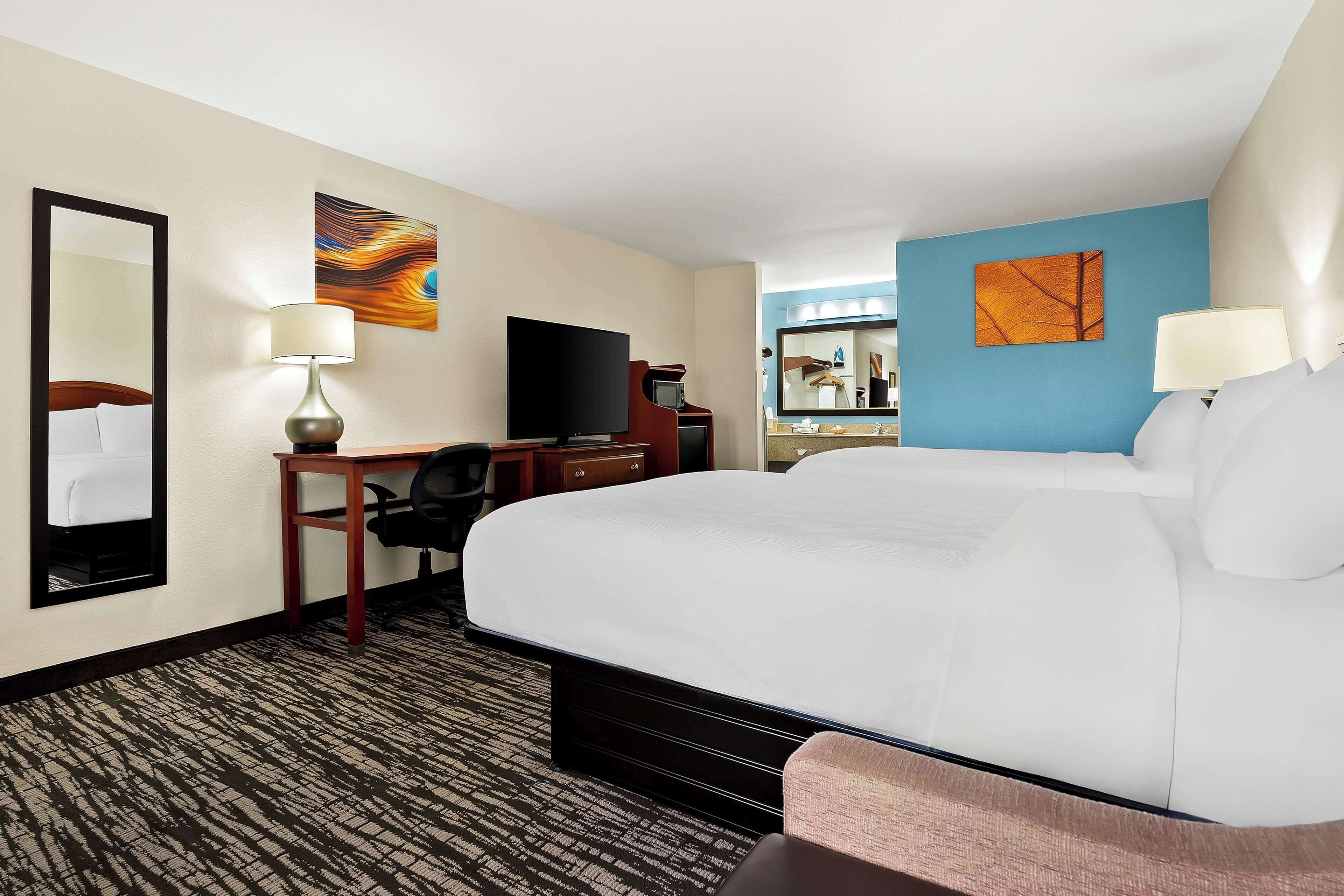 standard room, 2 queen beds, non smoking, refrigerator & microwave | 1 bedroom, desk, blackout curtains, iron/ironing board