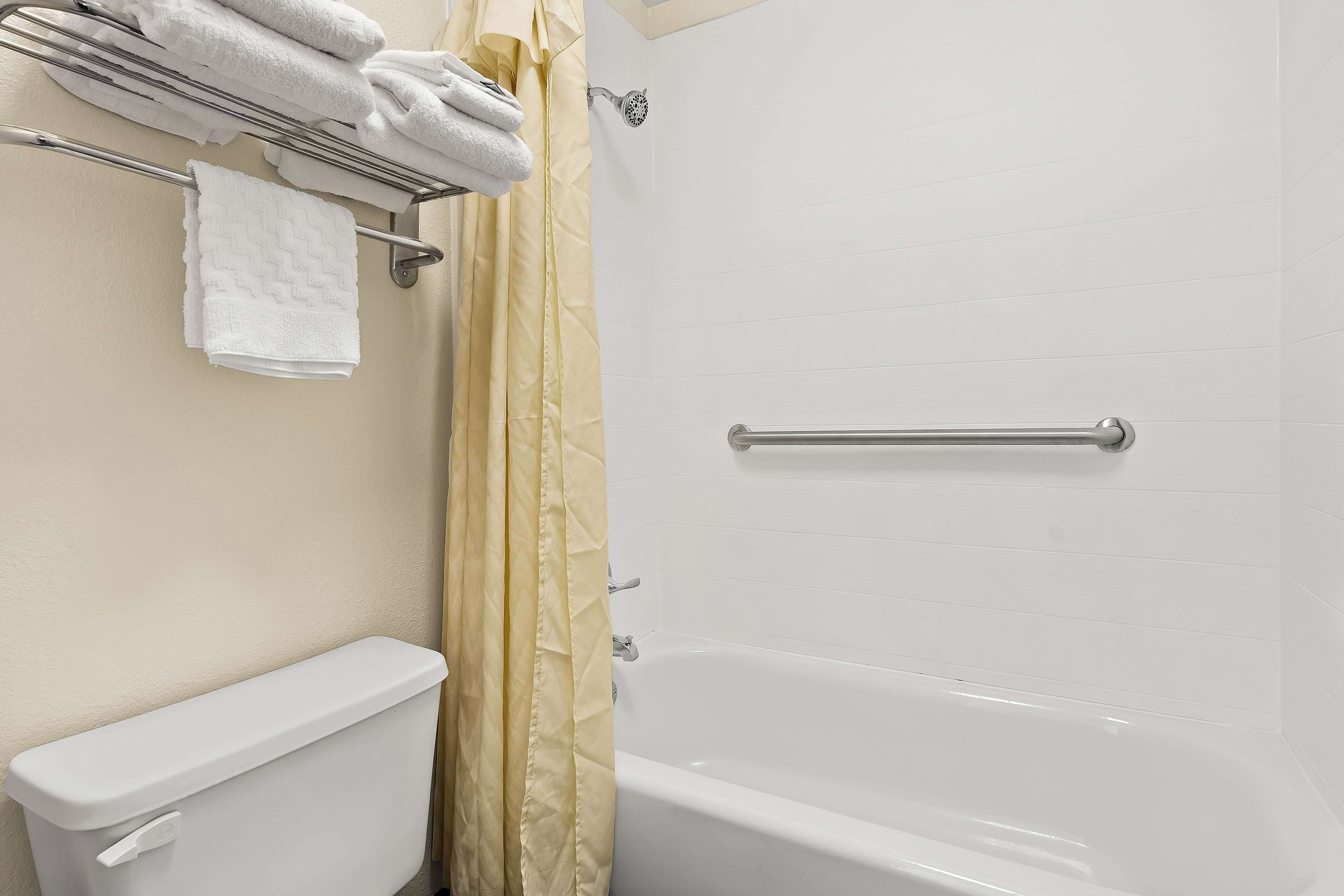 standard room, 2 queen beds, non smoking, refrigerator & microwave | bathroom | combined shower/bathtub, eco-friendly toiletries, hair dryer, towels