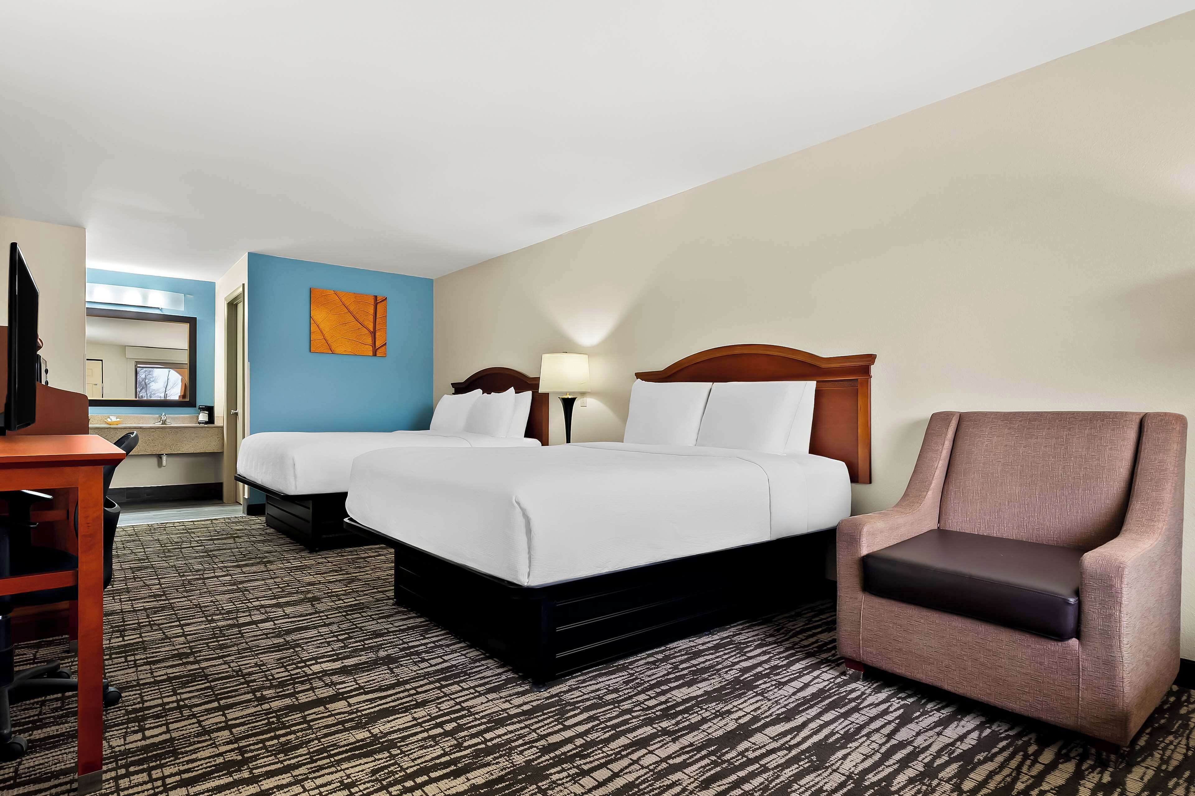 standard room, 2 queen beds, non smoking, refrigerator & microwave | 1 bedroom, desk, blackout curtains, iron/ironing board