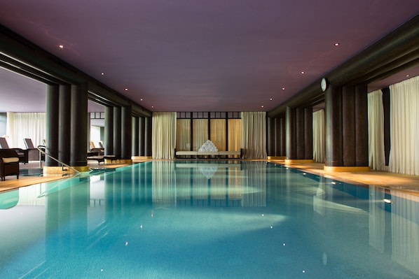 Indoor pool, seasonal outdoor pool, pool umbrellas, pool loungers