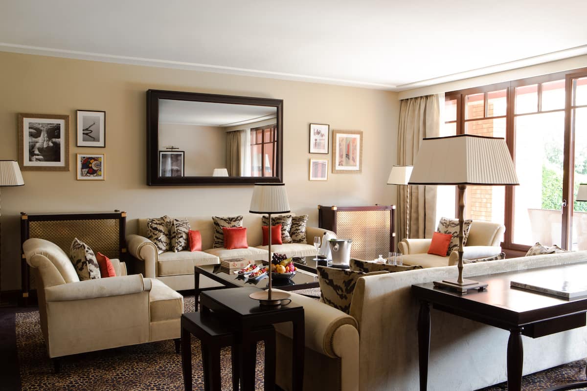 Presidential Suite, 1 King Bed | Living room | 40-inch flat-screen TV with satellite channels, TV, pay movies