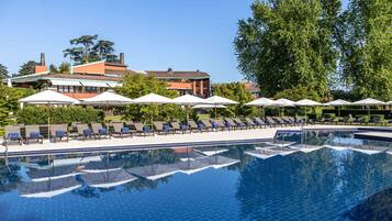 Indoor pool, seasonal outdoor pool, pool umbrellas, pool loungers