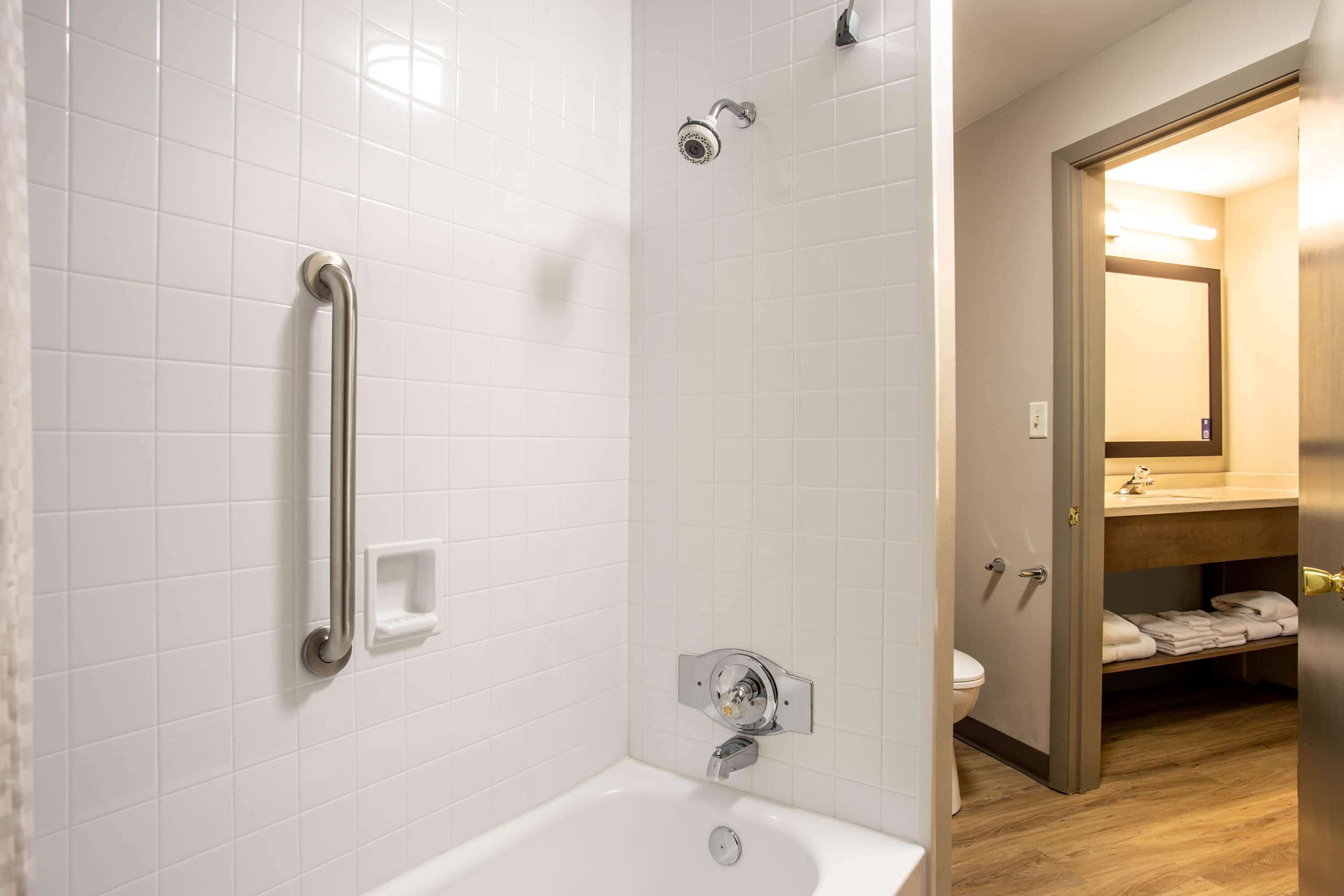 2 queen beds, studio suite, non-smoking | bathroom | combined shower/bathtub, free toiletries, hair dryer, towels
