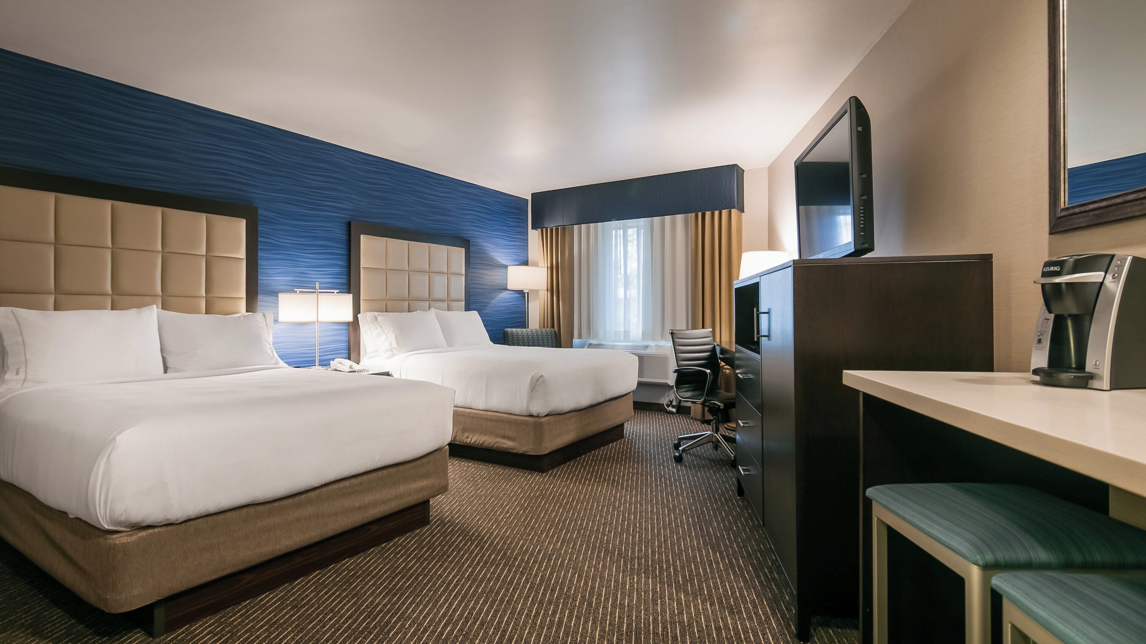 Premium bedding, pillowtop beds, desk, laptop workspace