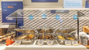 A buffet with labeled hot food options including turkey sausage, pork sausage, and cheese omelet. - Holiday Inn Express Bellingham by IHG (Bellingham)