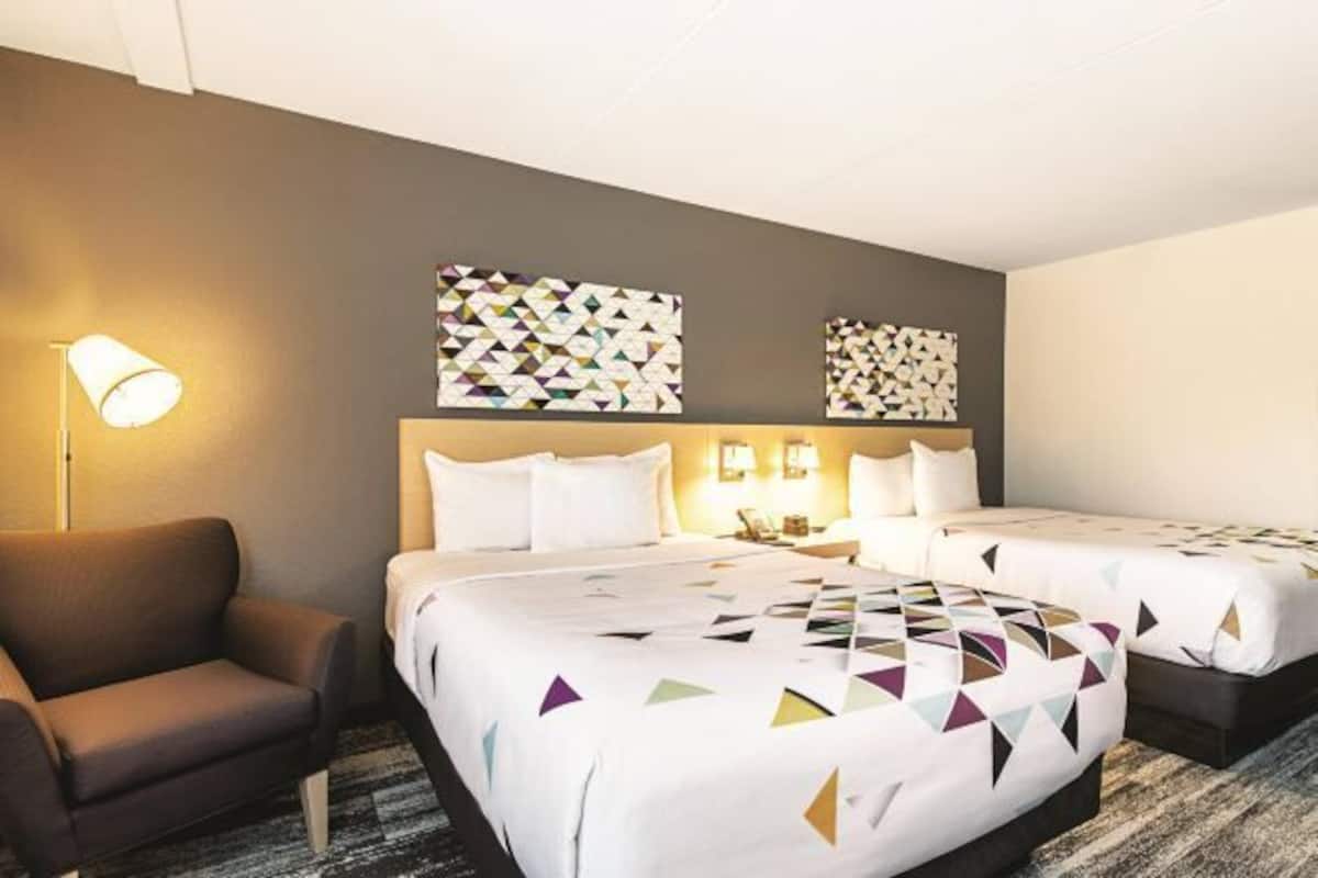 Desk, laptop workspace, blackout drapes, iron/ironing board