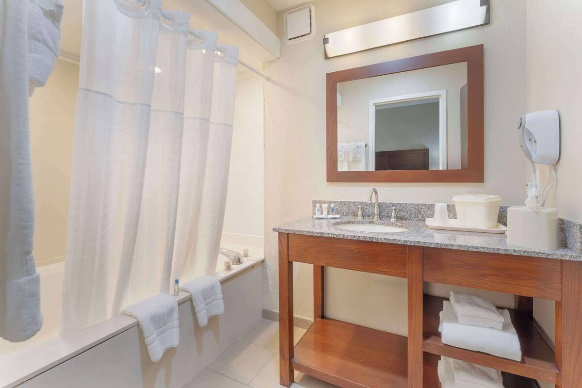 suite, 1 king bed with sofa bed, non smoking (2 rooms) | in-room safe, desk, iron/ironing board, free cots/infant beds