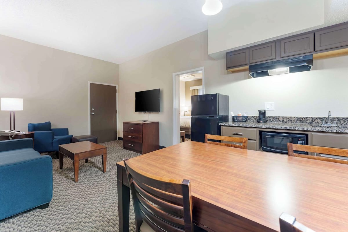 suite, 1 king bed with sofa bed, non smoking (2 rooms) | in-room safe, desk, iron/ironing board, free cots/infant beds