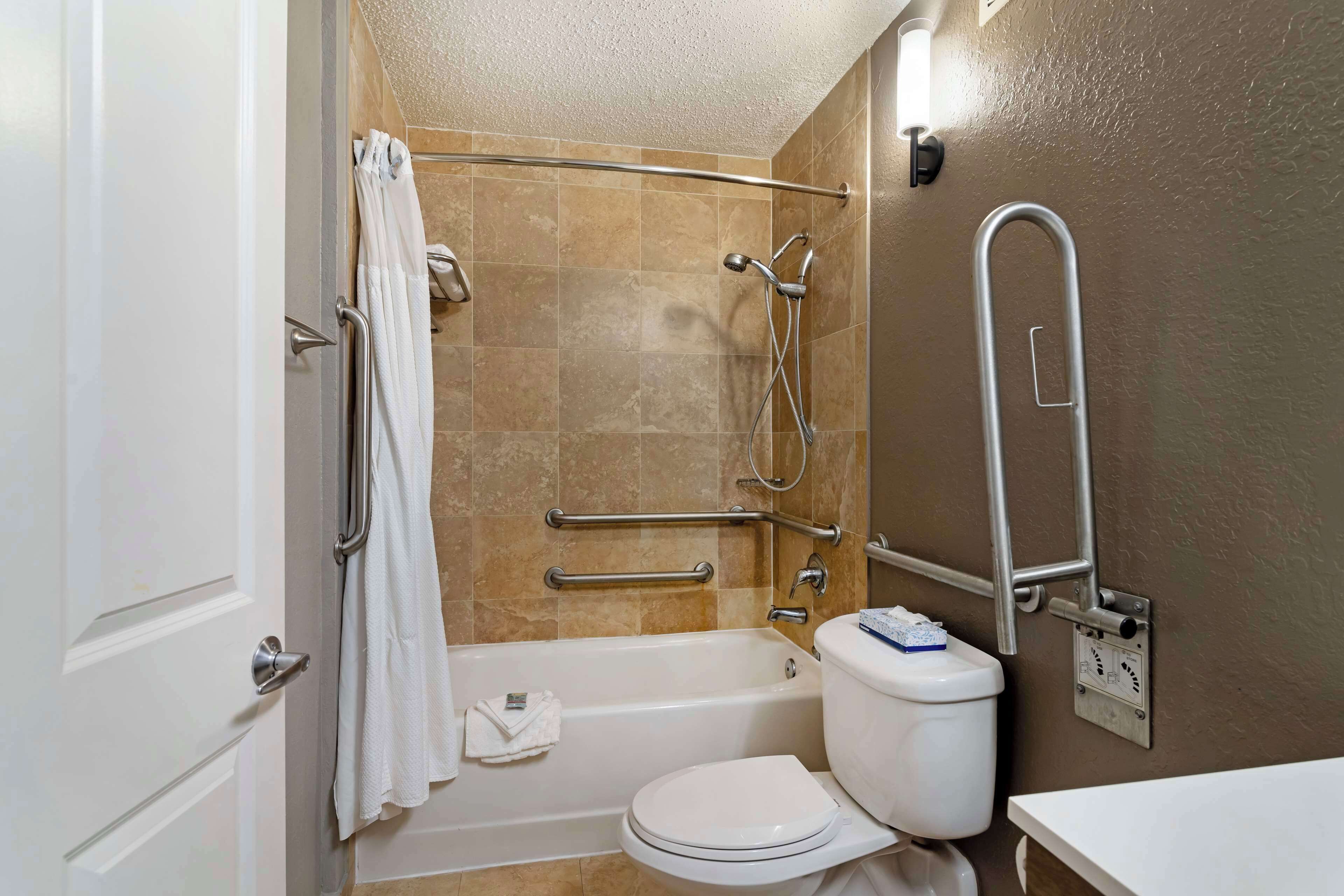 standard room, 2 queen beds, accessible, refrigerator | bathroom | combined shower/bathtub, eco-friendly toiletries, hair dryer, towels