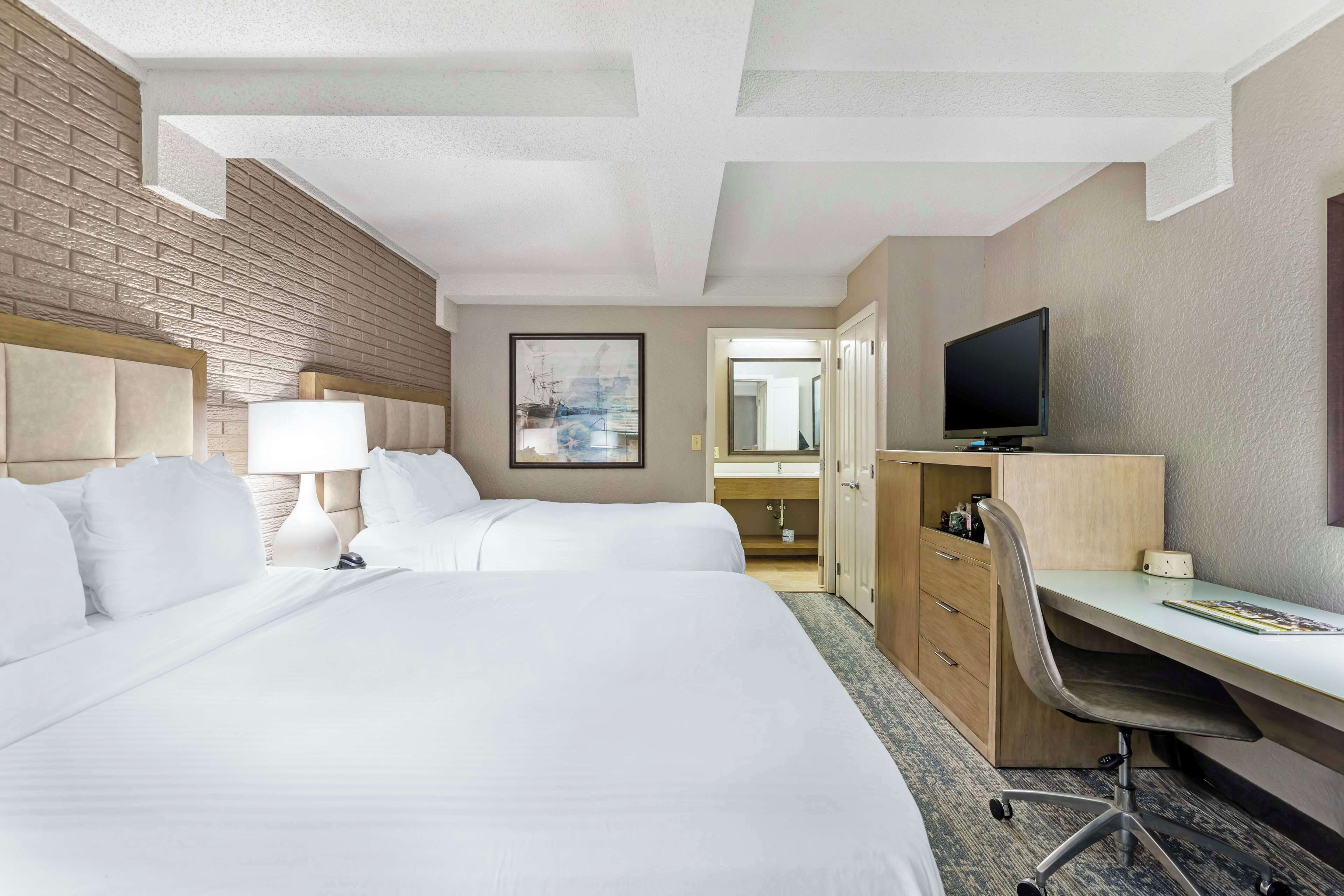 standard room, 2 queen beds, non smoking, refrigerator | premium bedding, pillow-top beds, in-room safe, desk