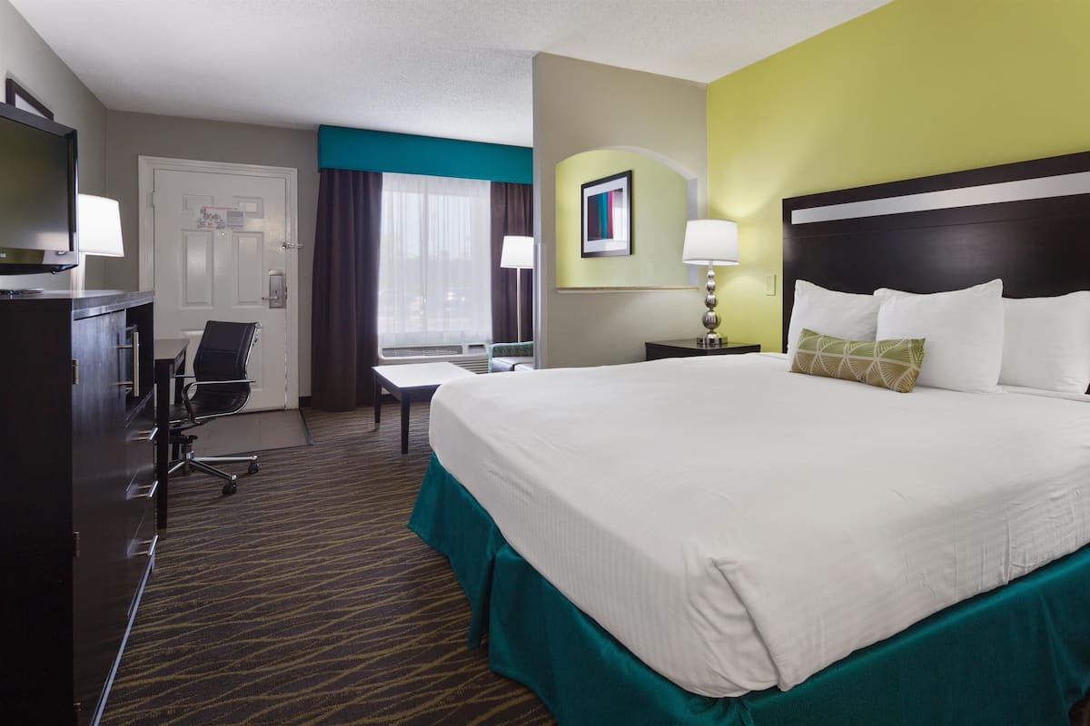 Premium bedding, pillow-top beds, laptop workspace, soundproofing
