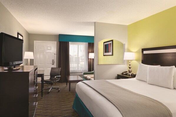 Premium bedding, pillow-top beds, laptop workspace, soundproofing