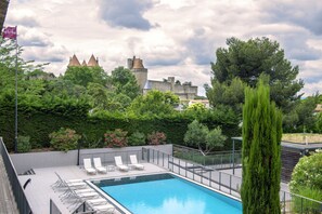 Seasonal outdoor pool, open 9:00 AM to 8:30 PM, pool umbrellas