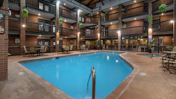 Indoor pool, open 9:00 AM to 9:00 PM, pool loungers