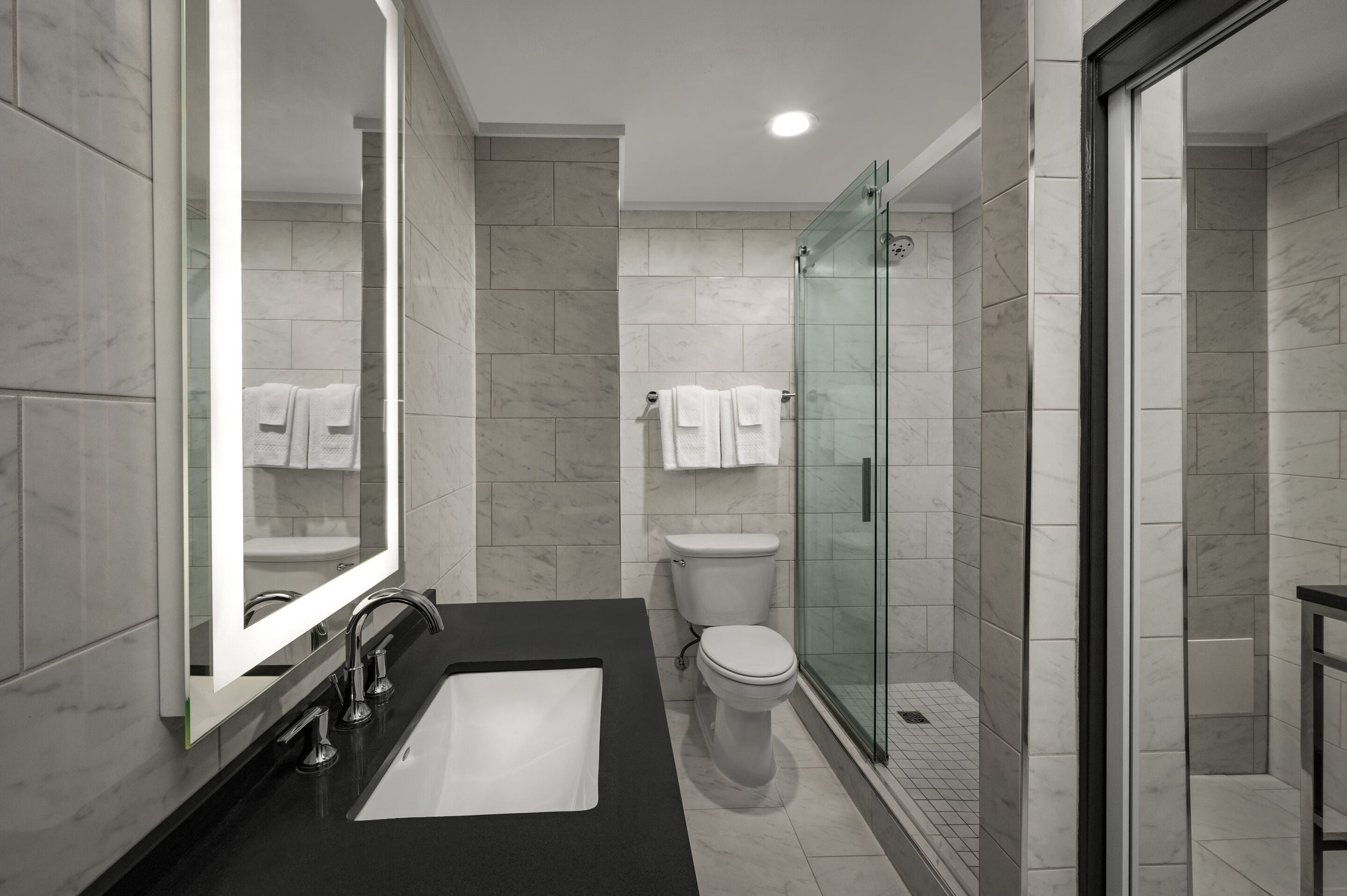 designer toiletries, hair dryer, towels