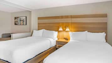 Premium bedding, desk, laptop workspace, blackout drapes