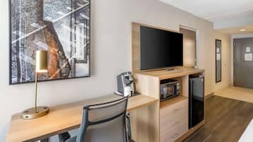 Premium bedding, desk, laptop workspace, blackout drapes