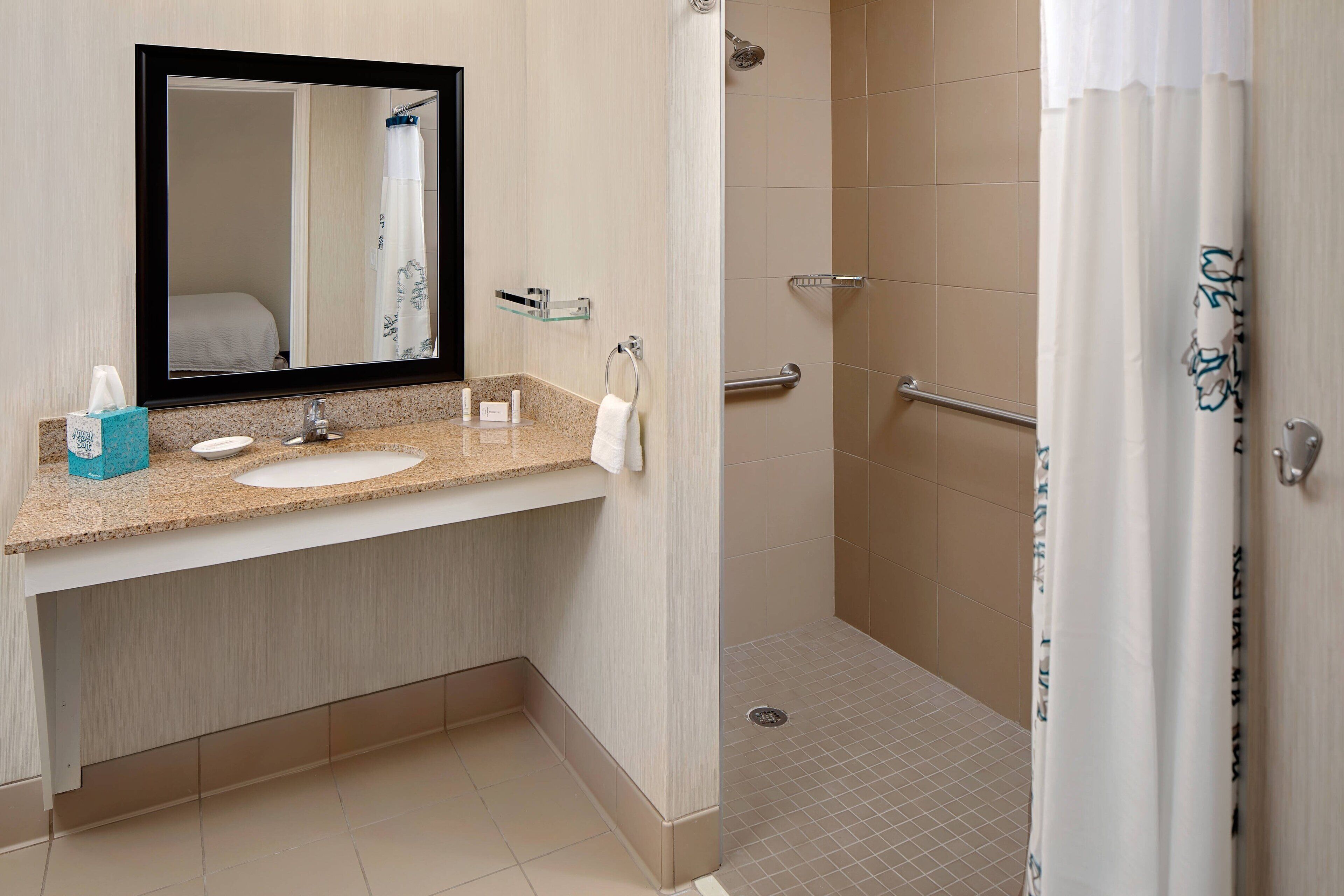 studio, 1 queen bed with sofa bed (mobility/hearing access, roll-in shwr) | bathroom | combined shower/bathtub, free toiletries, hair dryer, towels