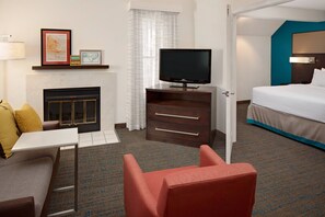 Penthouse Suite with Fireplace | Premium bedding, pillowtop beds, individually decorated