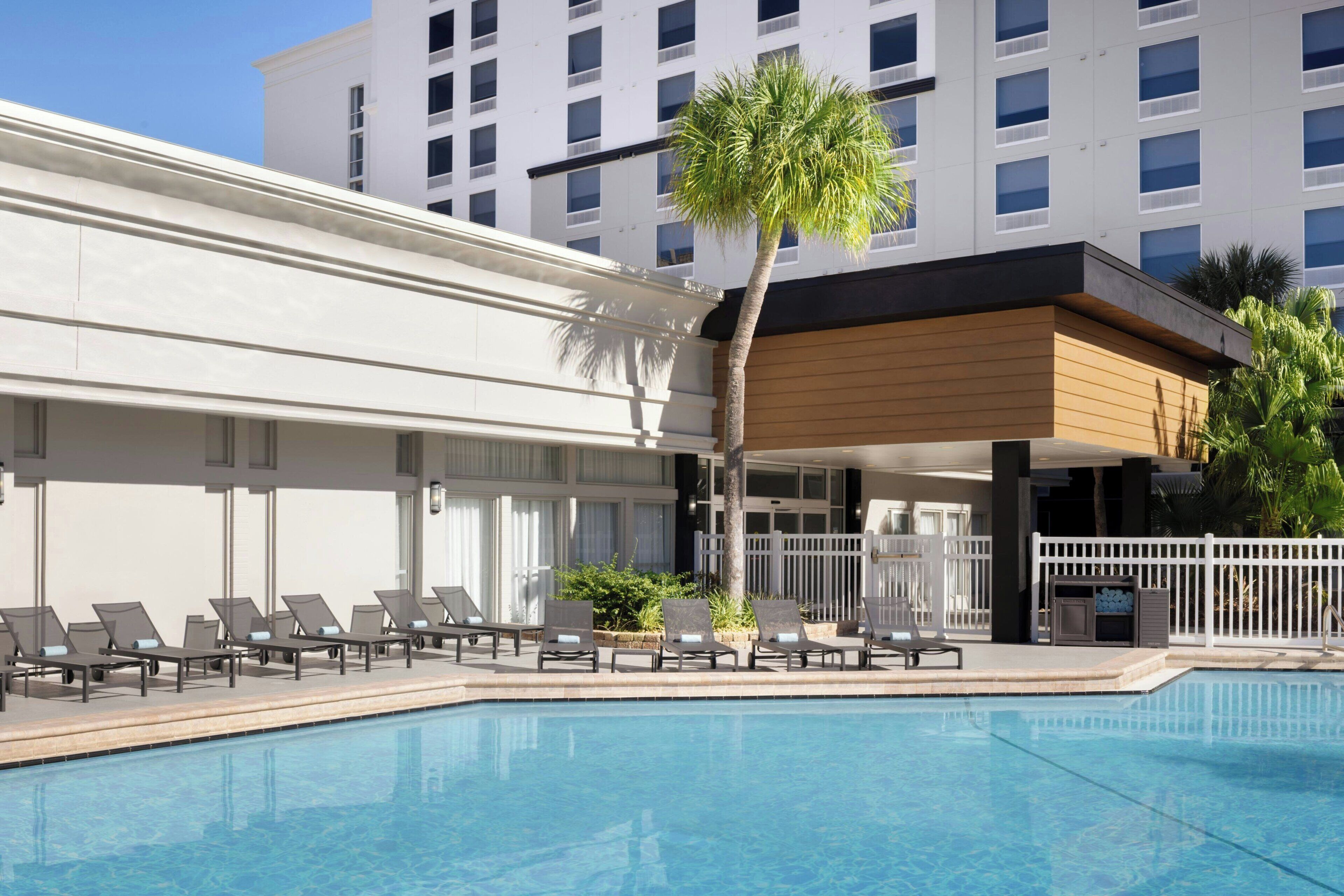 Outdoor pool, open 9 AM to 11 PM, pool umbrellas, pool loungers