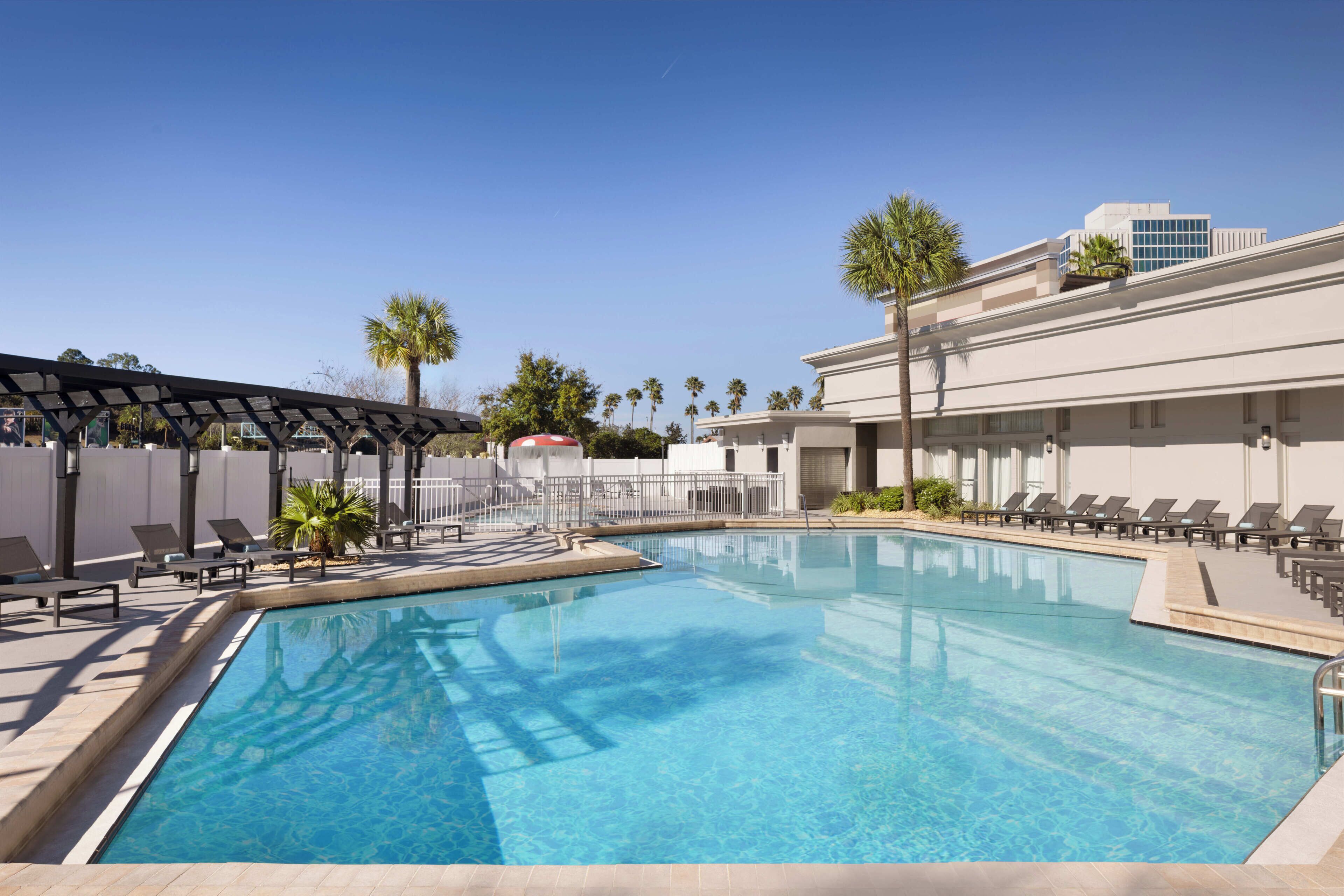 Outdoor pool, open 9 AM to 11 PM, pool umbrellas, pool loungers