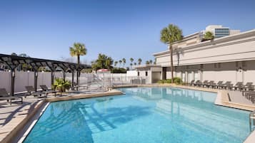 Outdoor pool, open 9 AM to 11 PM, pool umbrellas, pool loungers