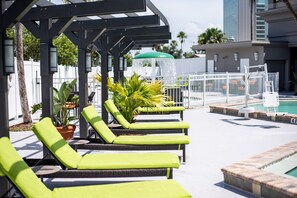 Outdoor pool, open 9 AM to 11 PM, pool umbrellas, pool loungers
