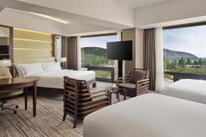 Deluxe Suite, Multiple Beds (Deluxe) | Minibar, in-room safe, blackout drapes, soundproofing