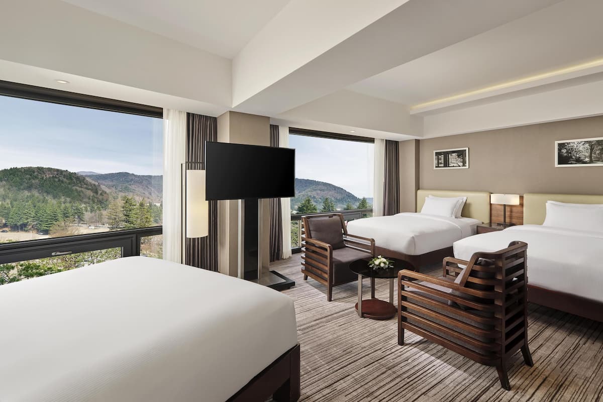 Deluxe Suite, Multiple Beds (Deluxe) | Minibar, in-room safe, blackout drapes, soundproofing