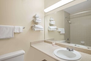 Combined shower/bathtub, eco-friendly toiletries, hair dryer, towels - Ramada by Wyndham Watertown/Thousand Islands NY (Watertown)