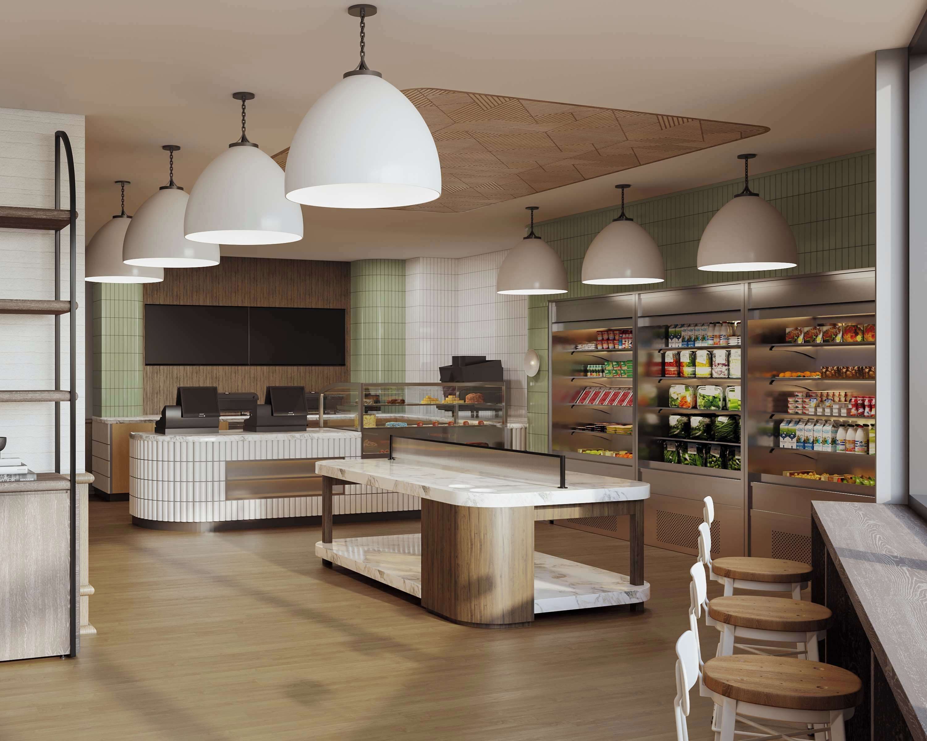 A modern cafe with a central island, bar seating, and a refrigerated display of beverages.