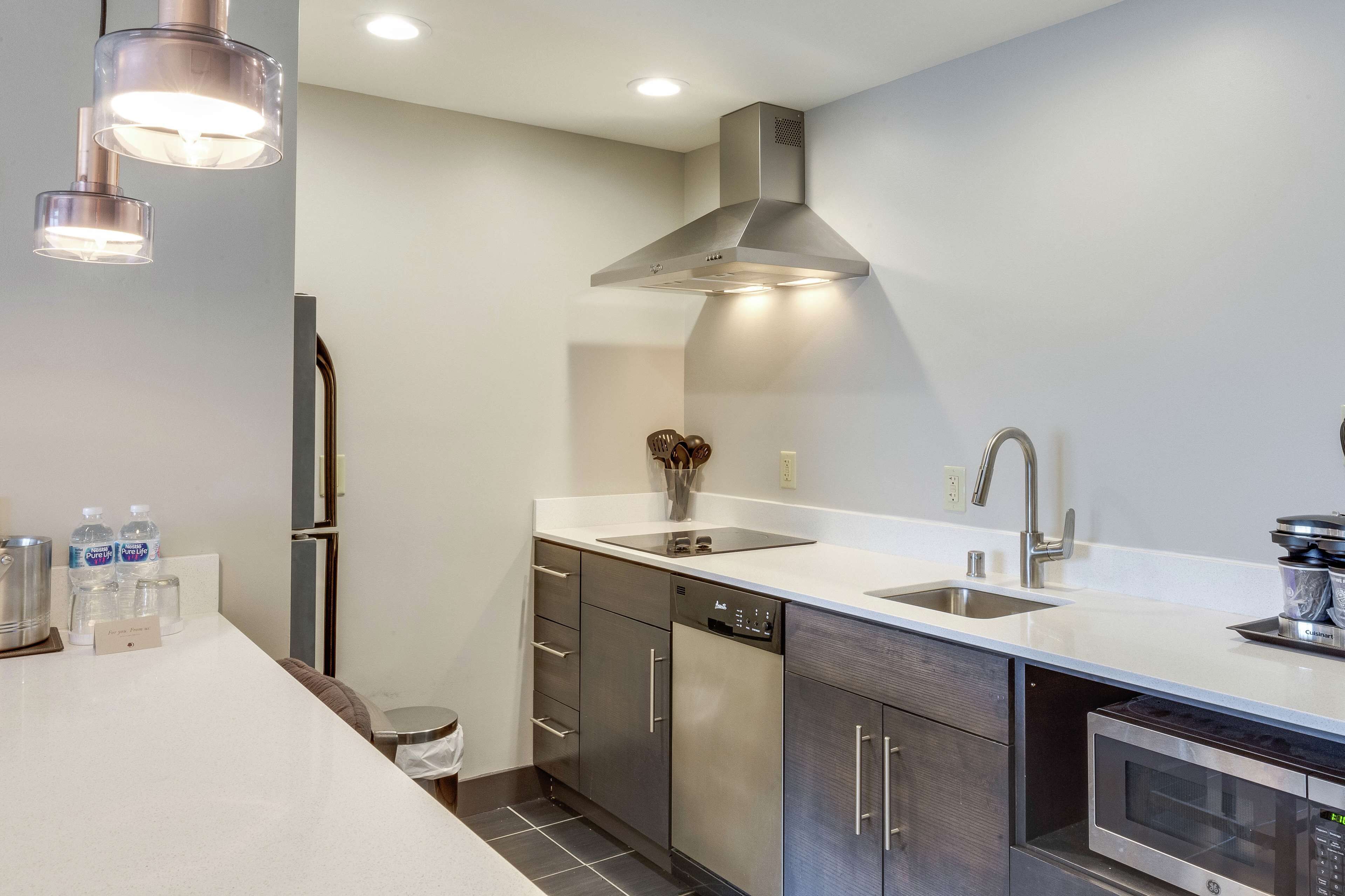 suite, 1 king bed, non smoking, kitchen | in-room safe, desk, iron/ironing board, free cots/infant beds