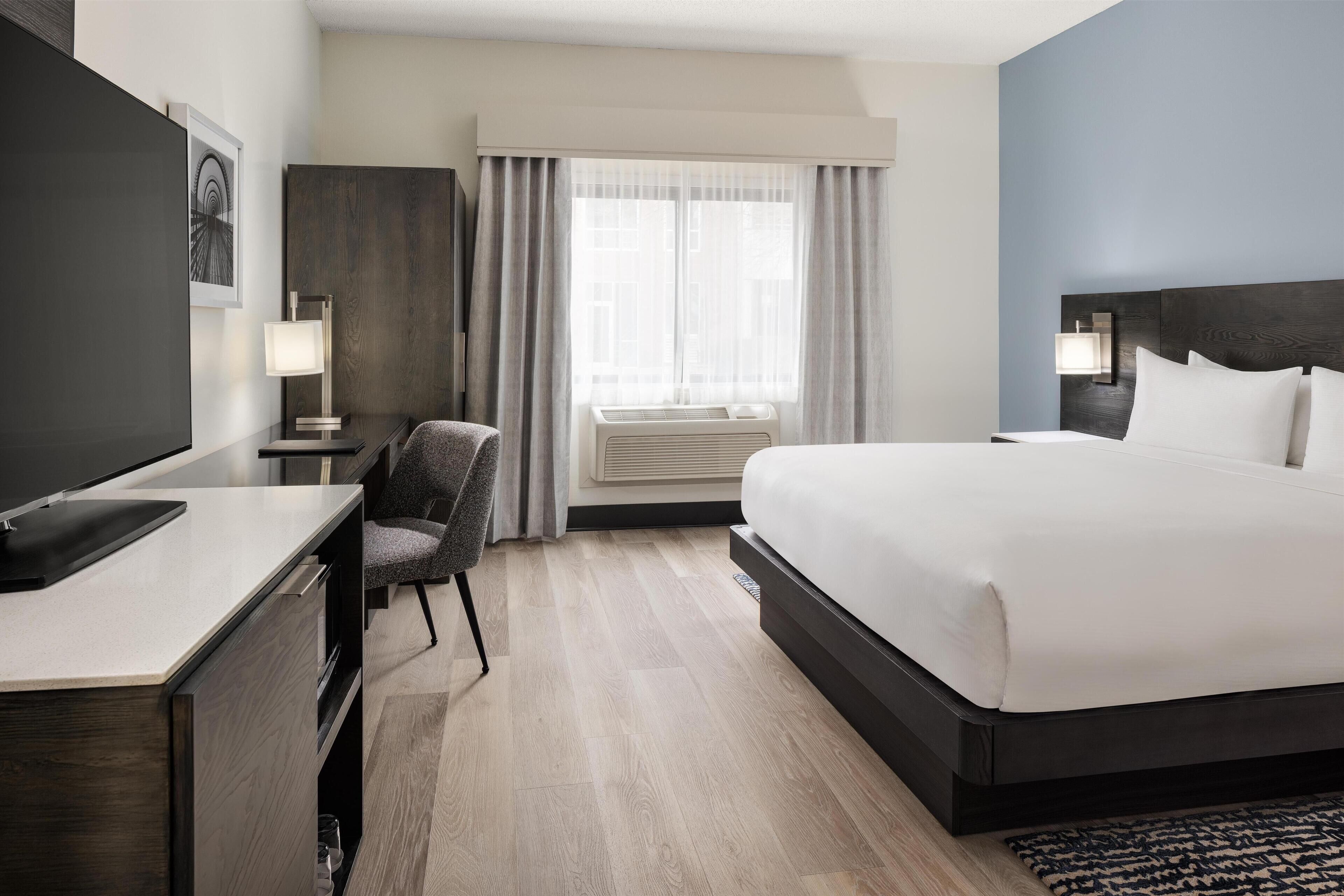 Room, 1 King Bed, Accessible, Non Smoking (w/ roll-in shower) | In-room safe, desk, iron/ironing board, free cribs/infant beds