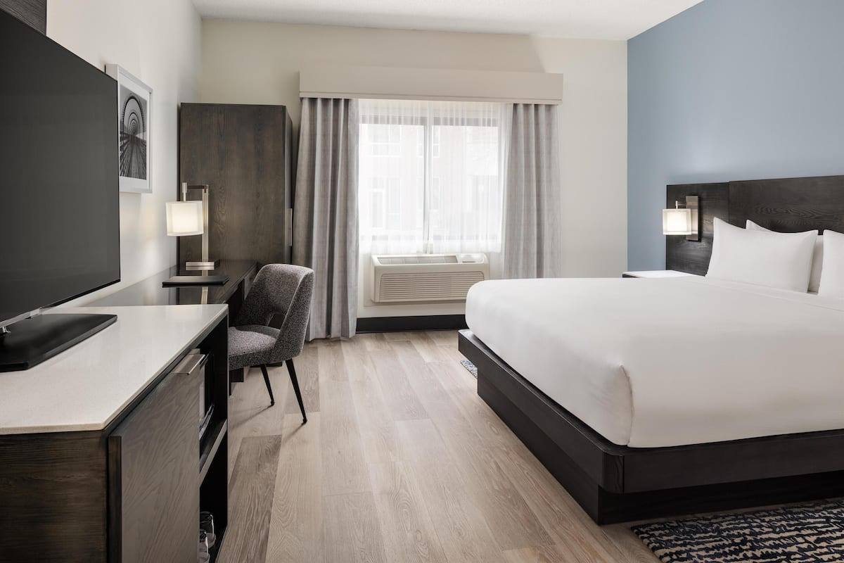 Room, 1 King Bed, Accessible, Non Smoking (w/ roll-in shower) | In-room safe, desk, iron/ironing board, free cribs/infant beds