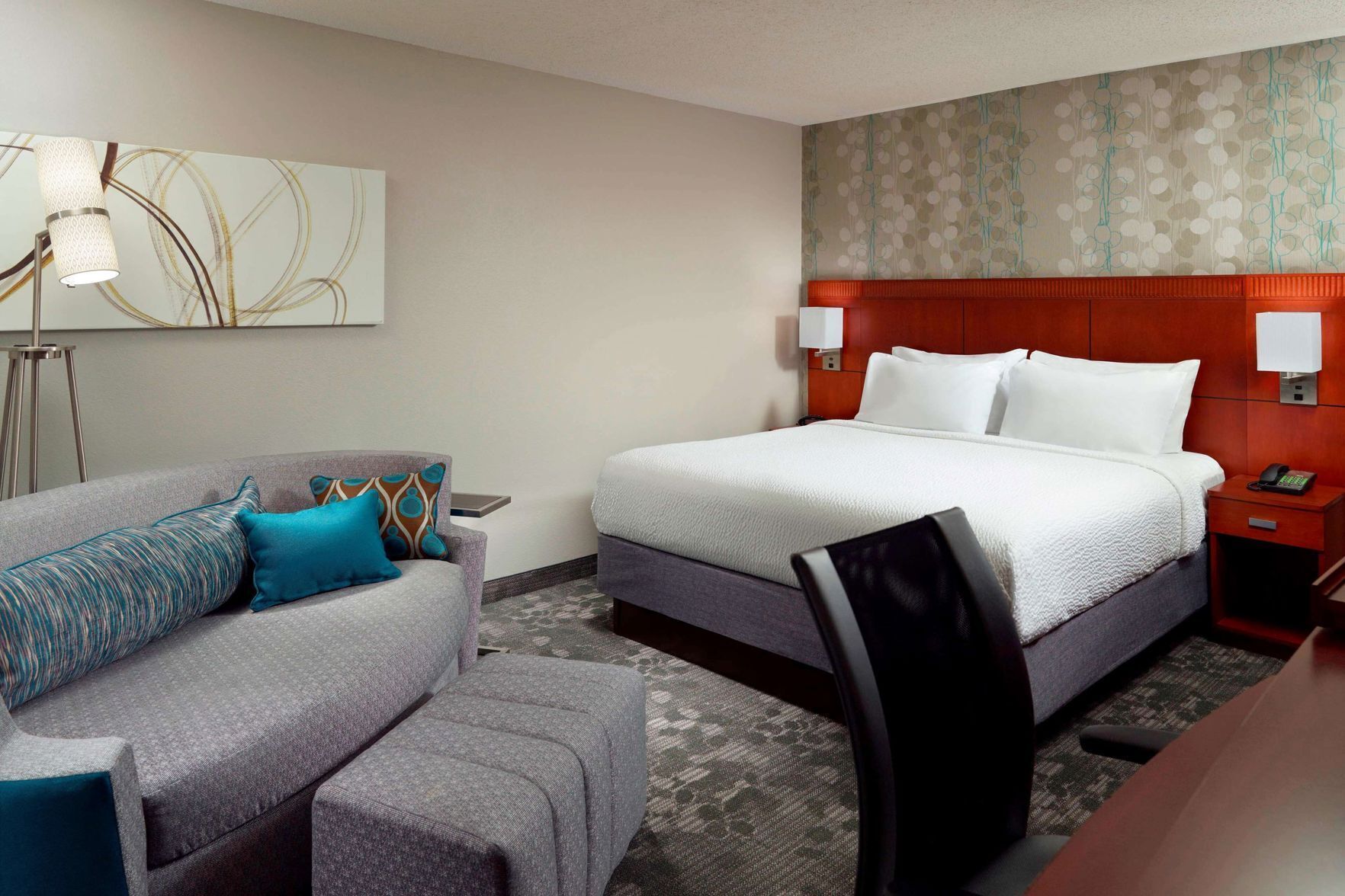 Premium bedding, desk, laptop workspace, blackout drapes